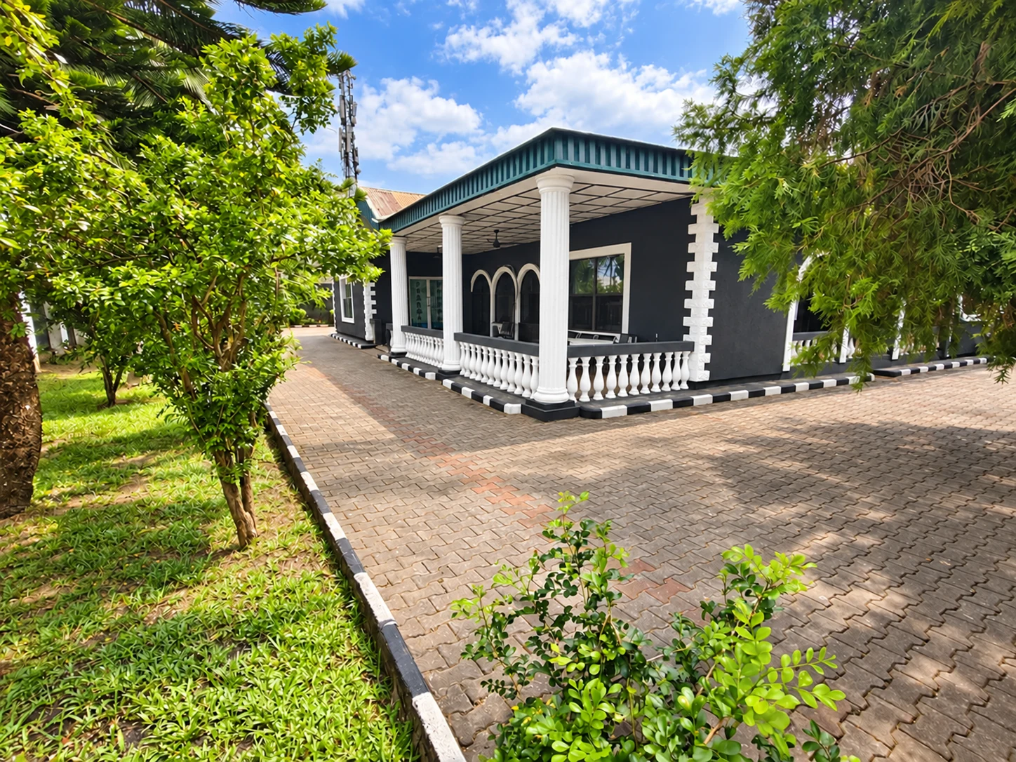 VAC Hospital veranda framed by garden trees
