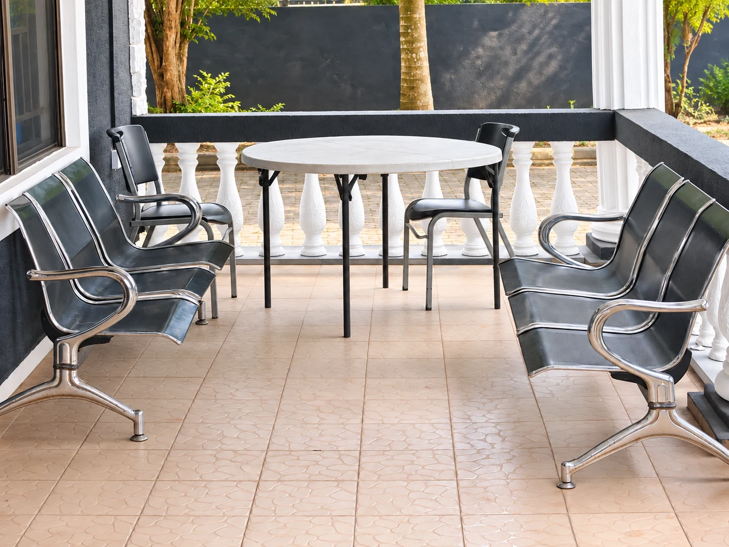 Seating and a table on the shaded hospital veranda